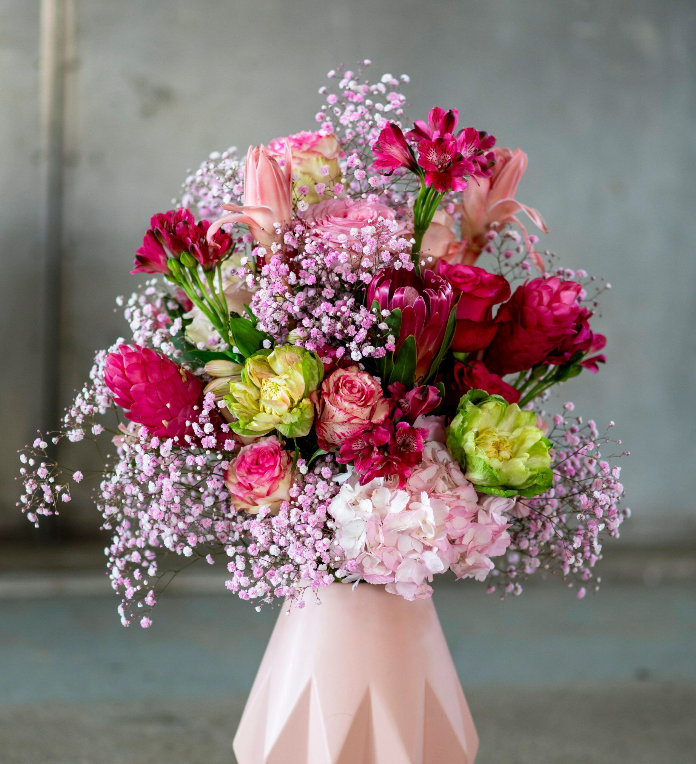 Premium assortment of fresh-cut flowers including roses, gypsophila and hydrangeas